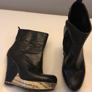 Black wedge booties with snakeskin detail